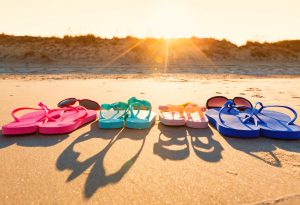 Image of sandals on a shockingly clean beach